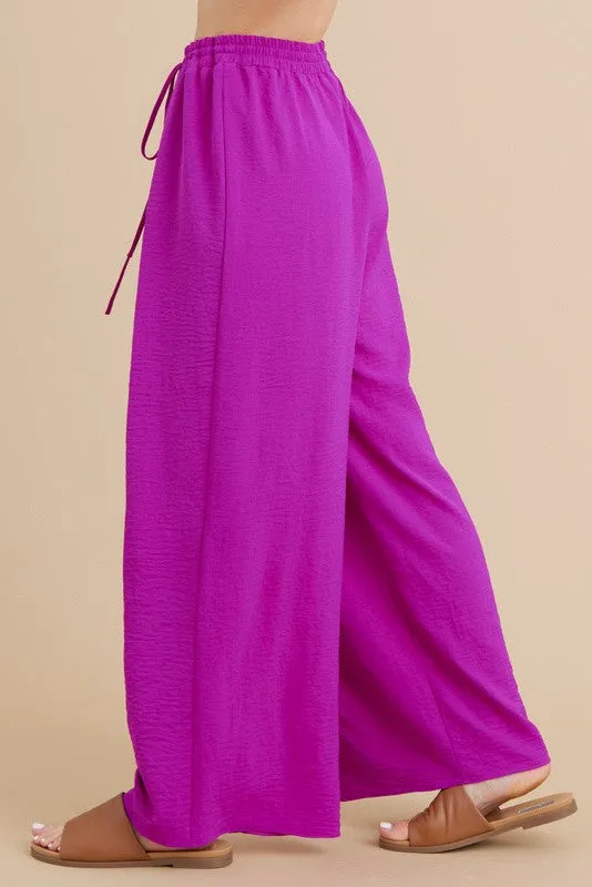 PLEATS FLARED PANTS