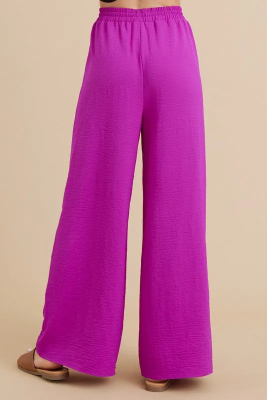 PLEATS FLARED PANTS