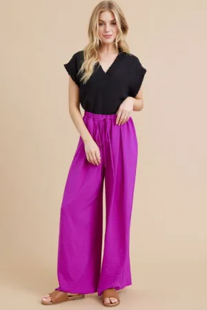 PLEATS FLARED PANTS