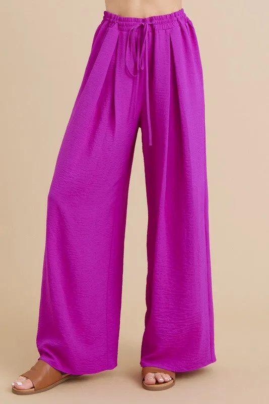 PLEATS FLARED PANTS