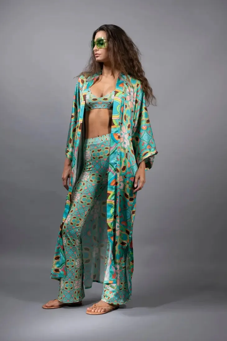 PSYCHEDELIC CROSSES AND STAR TEAL FLARED STRETCH PANTS